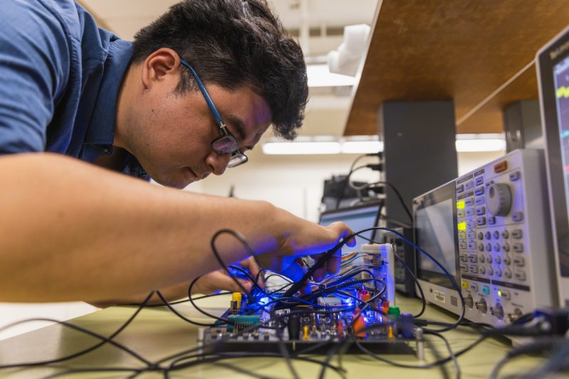 student works in multifunctional integrated circuits and systems lab 