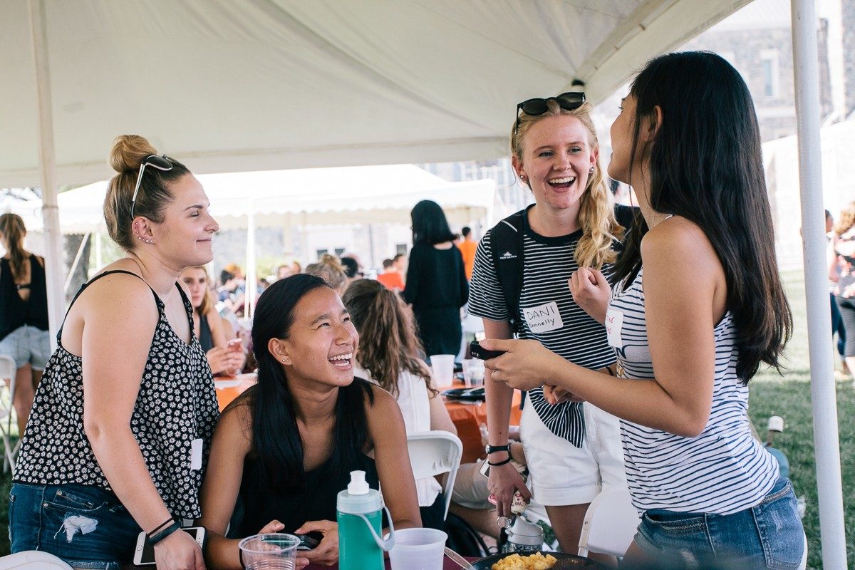 Students enjoy a light moment at the fall picnic.