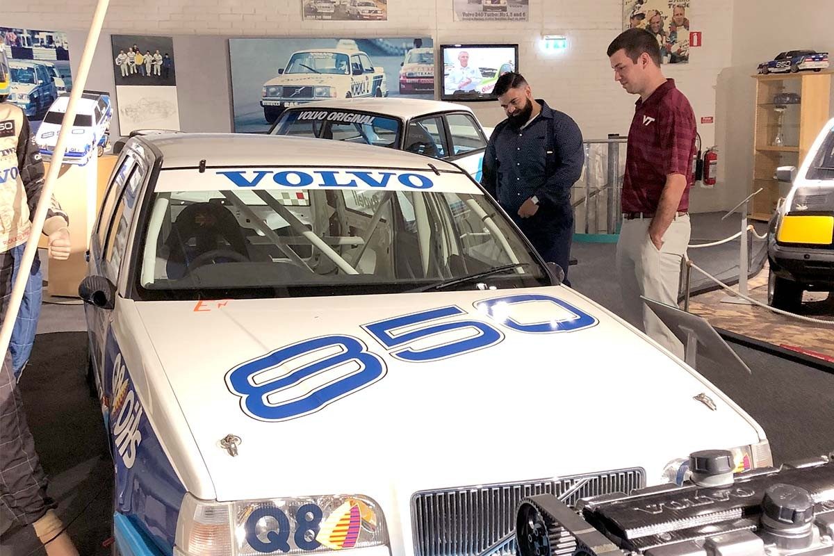 Steve Lally (left) and Harrison Worthen look at historical automotive racing exhibits at the Volvo Museum in Gothenburg, Sweden. (Photo Credit: Barbara Hoopes)
