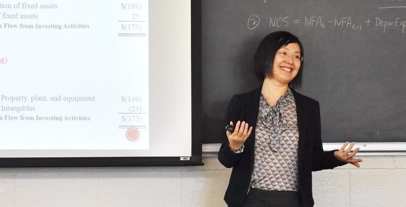 Jin Xu, associate professor of finance, received a Best Paper Award for an article she co-authored that examines the effects of corporate taxes on corporations’ market values. (Photo credit: Chris Marano)