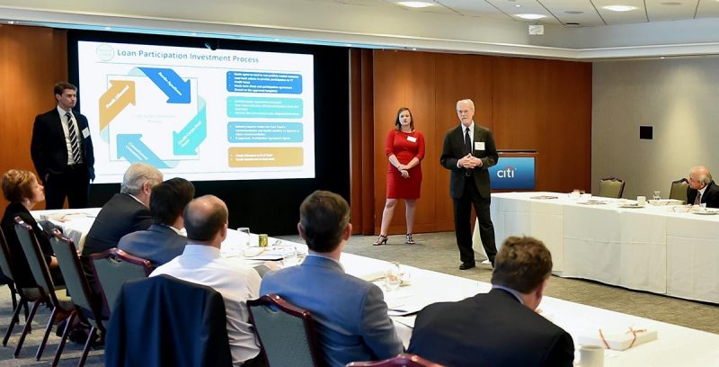 Finance professor George Morgan and finance students Quillin Gaffey (left) and Tracy Christensen present the proposal for Credit Corps at a meeting of the finance department’s advisory board in New York on April 4, 2019. (Photo credit: Dana Maxson)