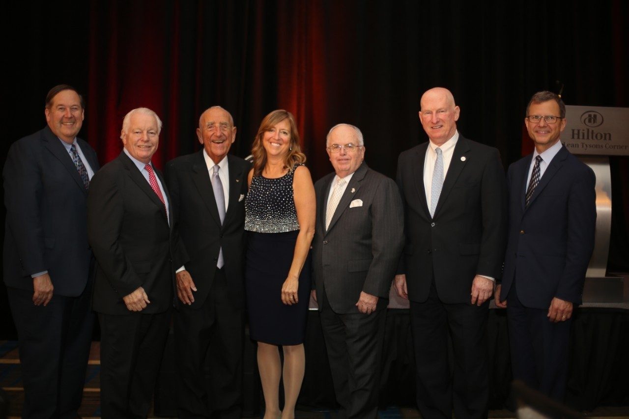 Feiertag, McGehee, and Pamplin College of Business dean Robert Sumichrast (far right) pose with hospitality executives (from left) Bob Gilbert (president, Hospitality Sales and Marketing Association International), Roger Dow (CEO, U.S. Travel Association), Joe McInerney (former CEO, American Hotel & Lodging Association), and Burch Sweeney (president, Golf Events & Meetings). (Photo credit: Holly Cromer)