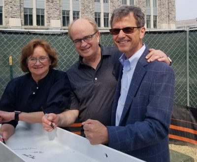 Dean Robert Sumichrast with John ’70, MBA ’72 and Phyllis M.S. ’73 Thompson after signing the beam. This was the Thompsons first time back to campus since 1976.