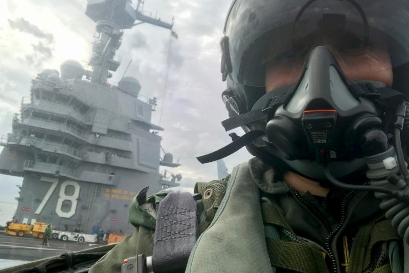 Cmdr. Stacy Uttecht waits on the deck of the USS Gerald R. Ford during a flight deck test in November 2017