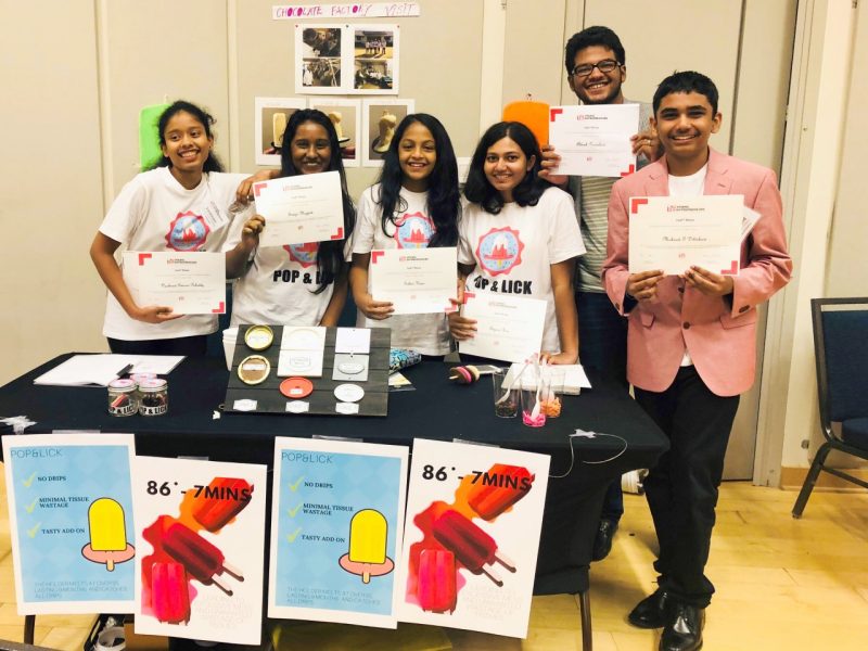 Students from India holding their certificates