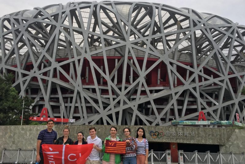 The students posed in front of Beijing's National Stadium. From left: Jack Speroni, Jamie Barlow, Jenna Nojaim, Philip Williams, Maddie Altobelli, Allison Desantis, Eileen Teng.
