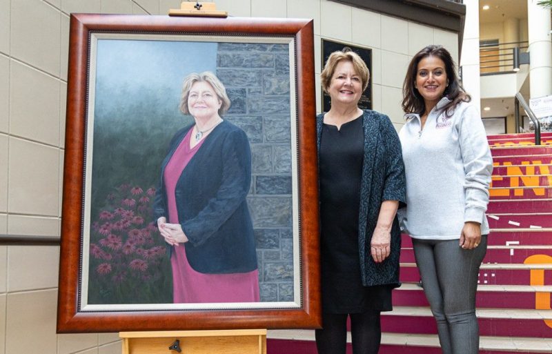 A portrait of former Pamplin College of Business Interim Dean Roberta "Robin" Russell was unveiled at a recent ceremony celebrating her four-decade career at Virginia Tech. Russell, pictured with Pamplin Dean Saonee Sarker, retired from the university in 2023. Photo by Andy Santos for Virginia Tech.