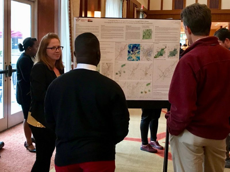 Sara Harrell, a Ph.D. student in the College of Architecture and Urban Studies, shares her poster with visiting students and faculty at the Virginia Tech HBCU/MSI Research Summit