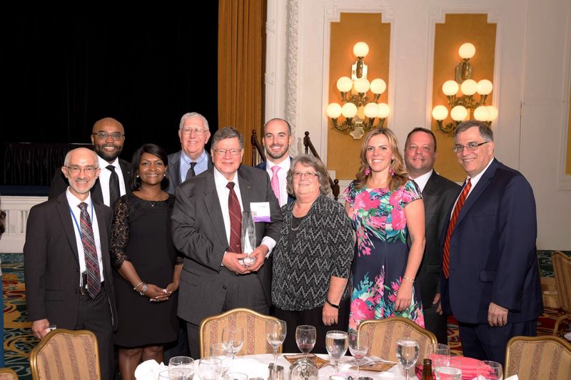 Dwight Shelton (center, holding award) was honored with the 2019 Virginia CFO Award (large nonprofit organization category), sponsored by Virginia Business magazine.