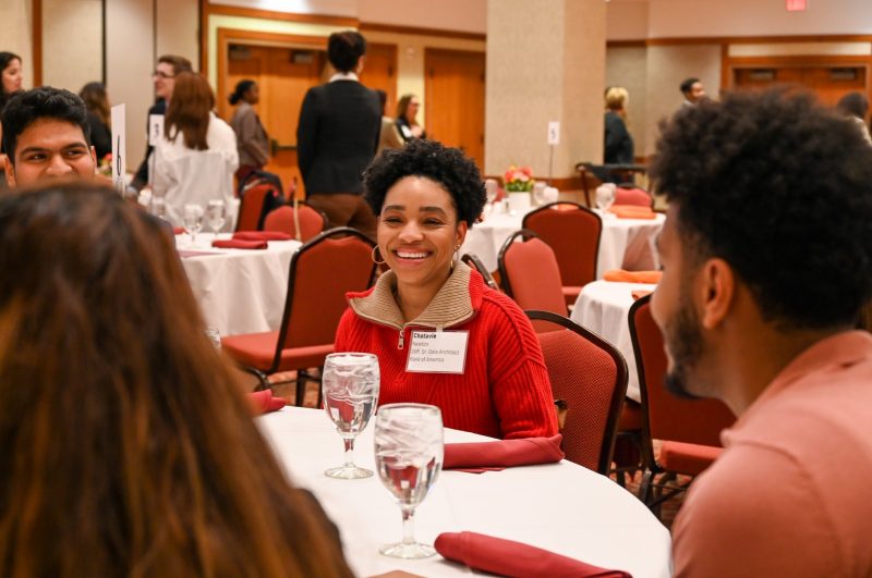Chatavie Newton, senior data architect with Bank of America, shares a moment of levity during Pamplin’s Spring Inclusion Dinner on Feb 1, 2023, at the Inn at Virginia Tech. Photo by A’me Dalton for Virginia Tech.